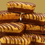 Os bolinhos Ana Maria com chocolate são um clássico da infância, adorados por sua maciez e sabor irresistível.